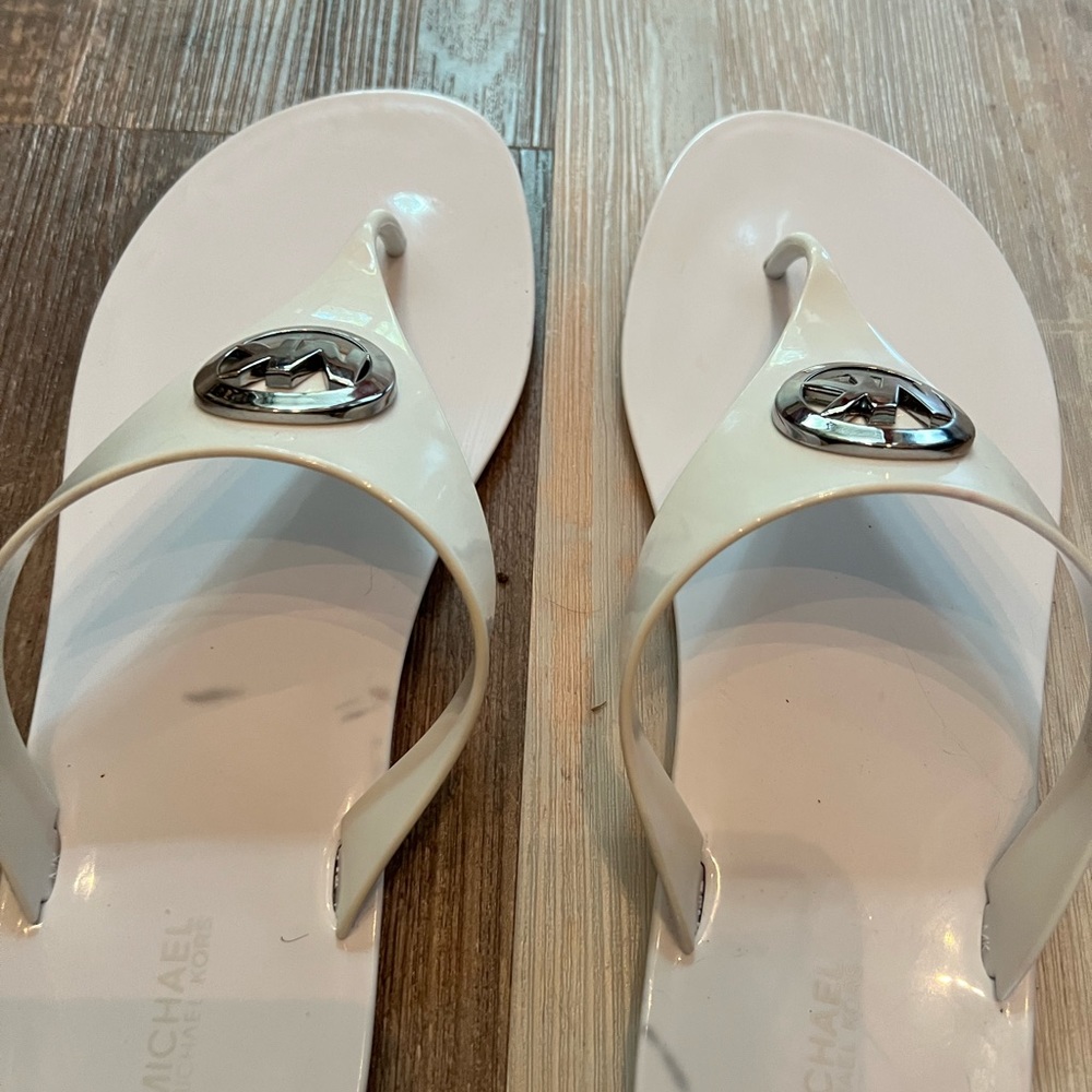 Michael Kors women’s size 11 plastic, vinyl-like thongs. Used, good condition.